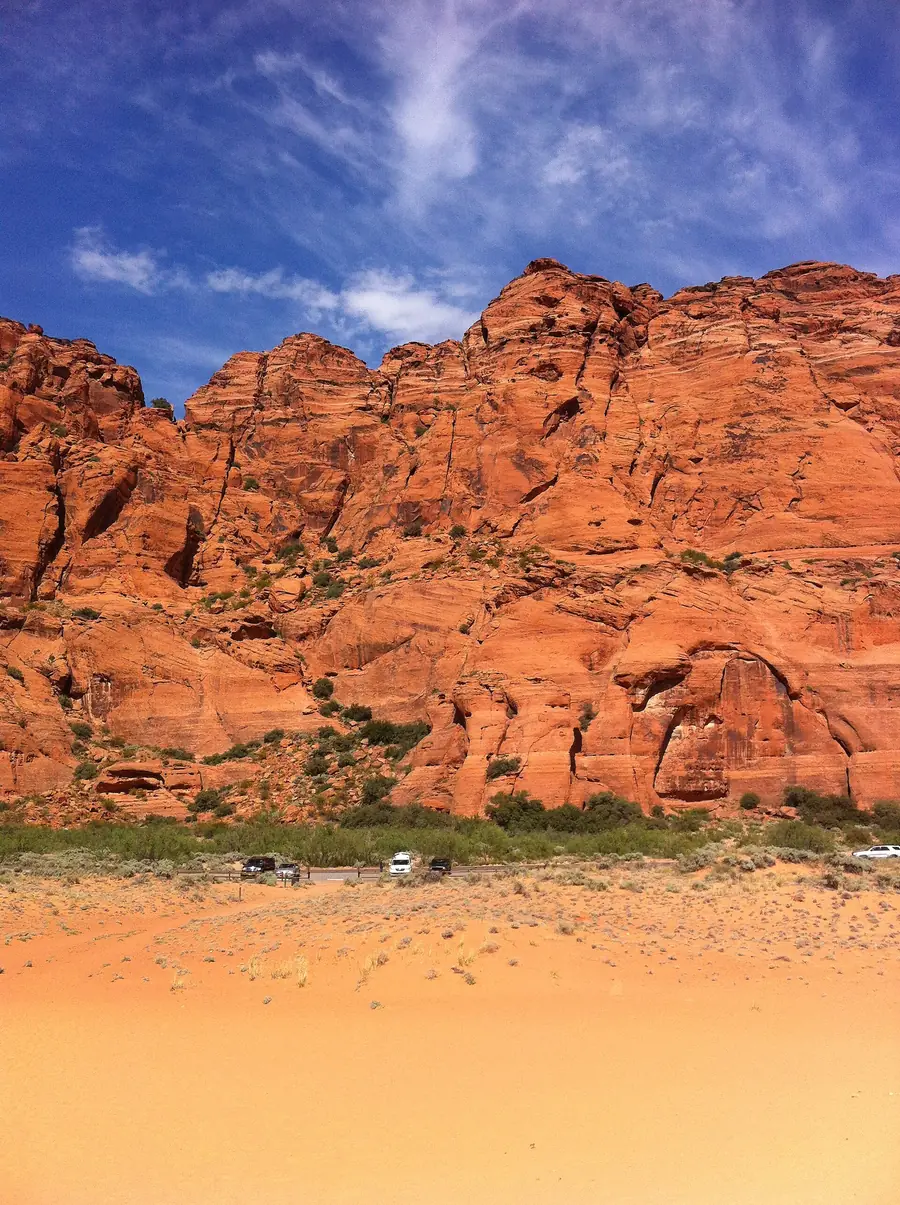 Tall orange-red sandstone rocks under a deep blue sky in Snow Canyon State Park.